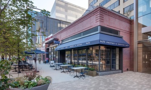 a building with tables and chairs outside