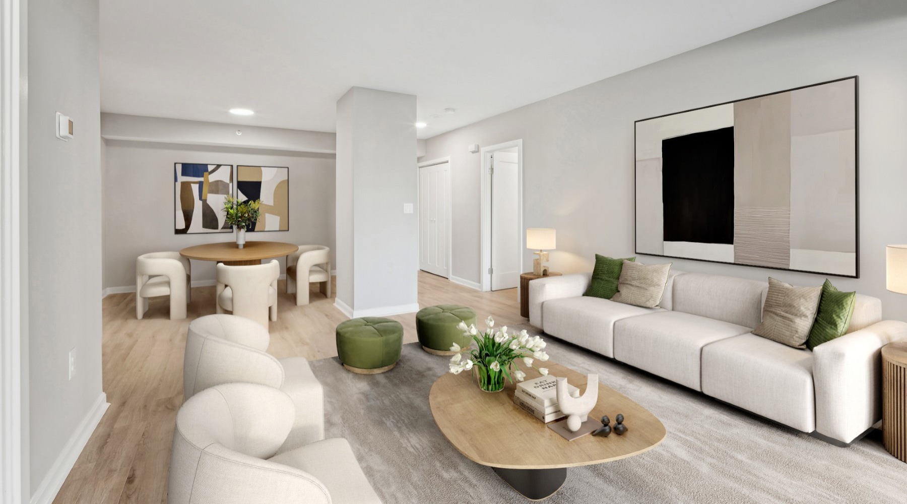 a living room with a couch, chairs and a coffee table