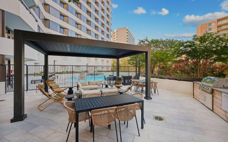 Outdoor lounge cabana with grilling counter and bistro seating