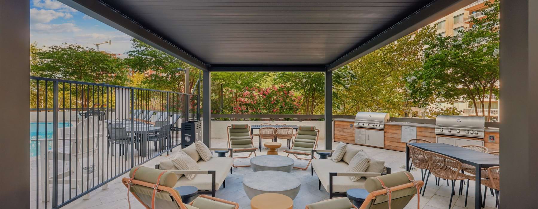 Resort-style outdoor swimming pool and lounge deck at Huxley apartments in Arlington VA