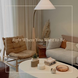 a living room with a couch, chair and a coffee table