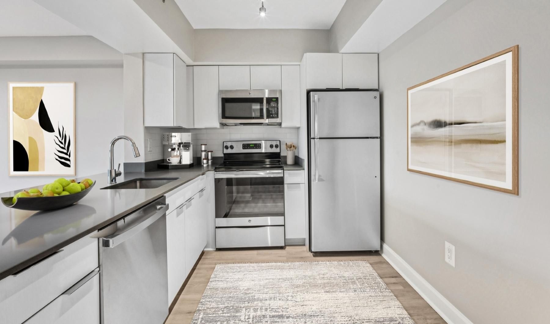 a kitchen with white cabinets