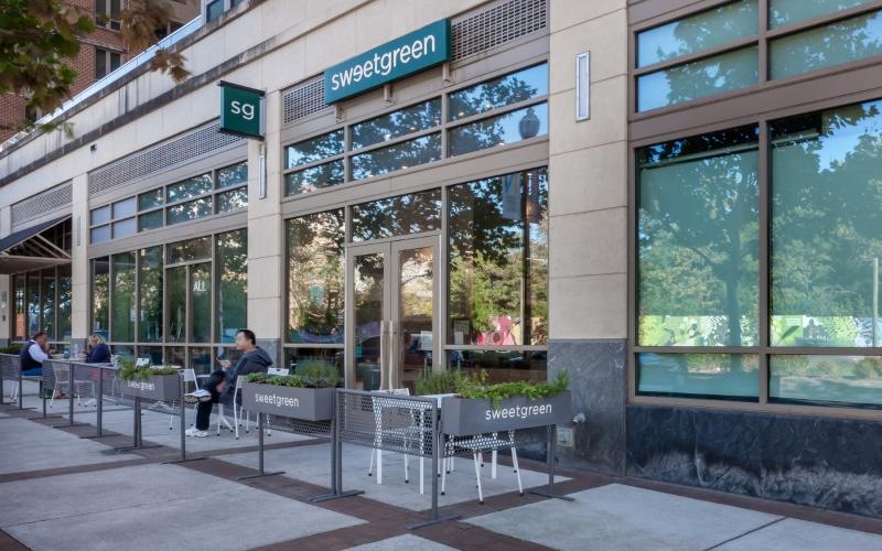 a building with windows and people outside