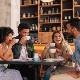 a group of people holding cups